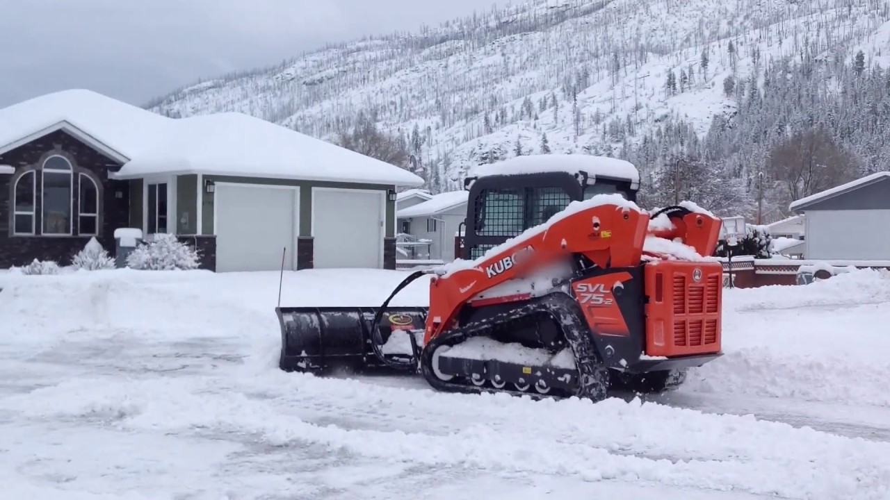 track loader moving snow